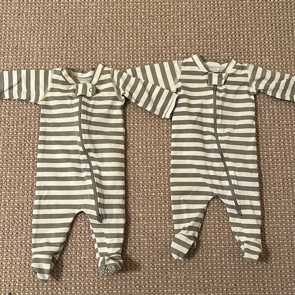 Monica and Andy zip up onesies